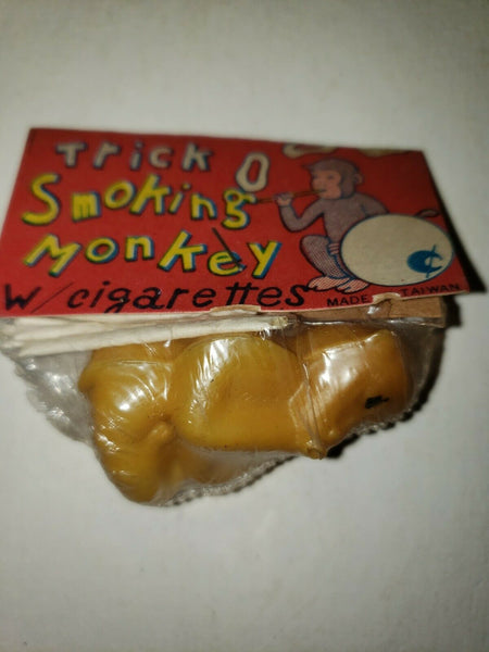 1960s Vintage Dime Store Toy Trick O Smoking Monkey w/ cigarette Yellow