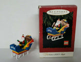 1994 Hallmark Santa's Lego Sleigh Here Comes Santa With Gift Bag Ornament  U19
